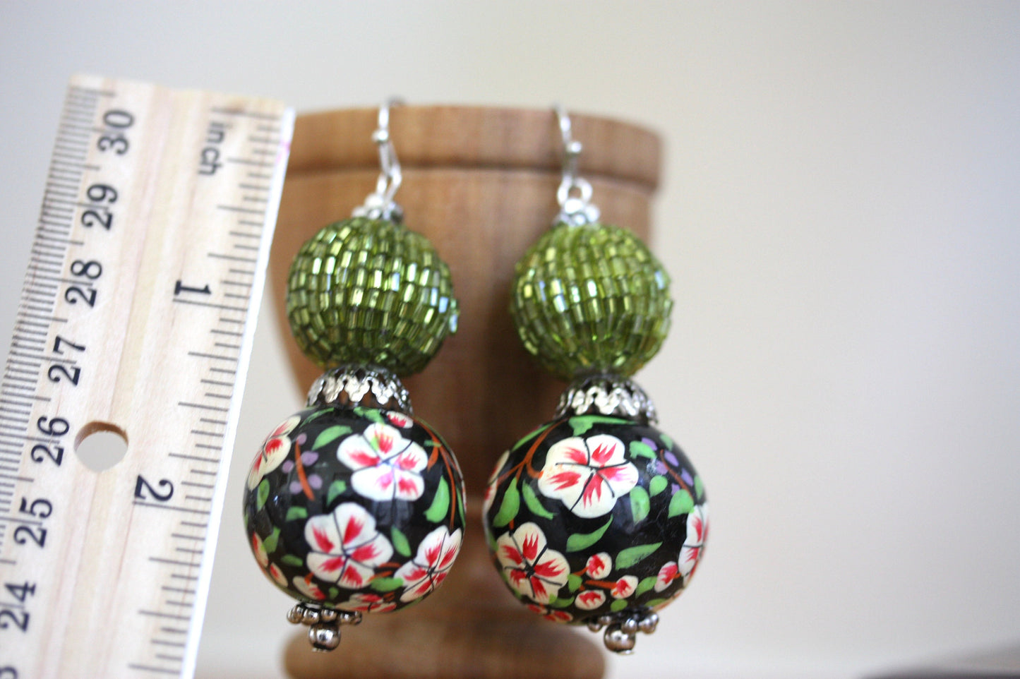 Green beaded bead and floral painted wood dangle earrings