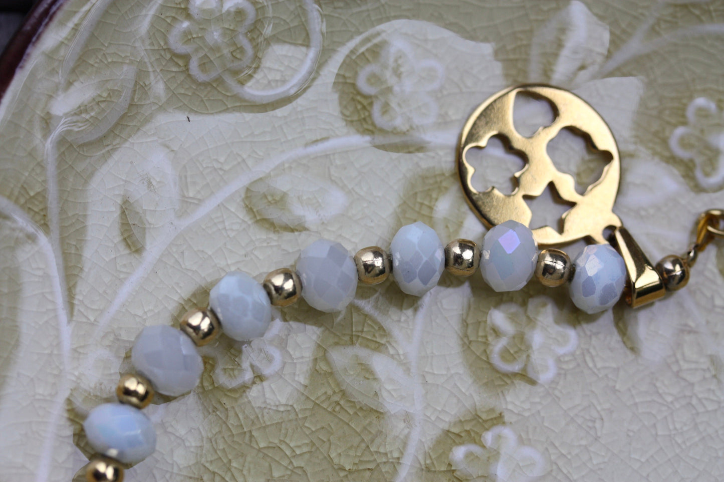 Vintage white faux crystal and goldtone beaded bracelet with unique charm