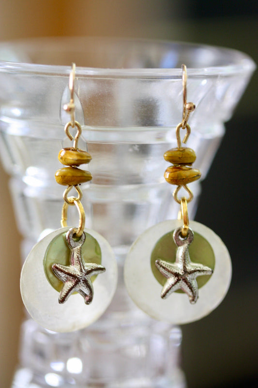 Mixed materials - green mother of pearl, metal starfish and yellow wood - beach themed dangle earrings