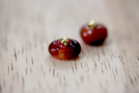 Small little orange glass stud earrings
