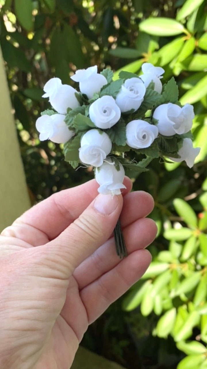 Three dozen (36) individually wire stemmed faux flowers - available in 3 colors - blue, yellow or white