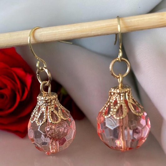 Pink faceted faux crystal earrings with goldstone filigree
