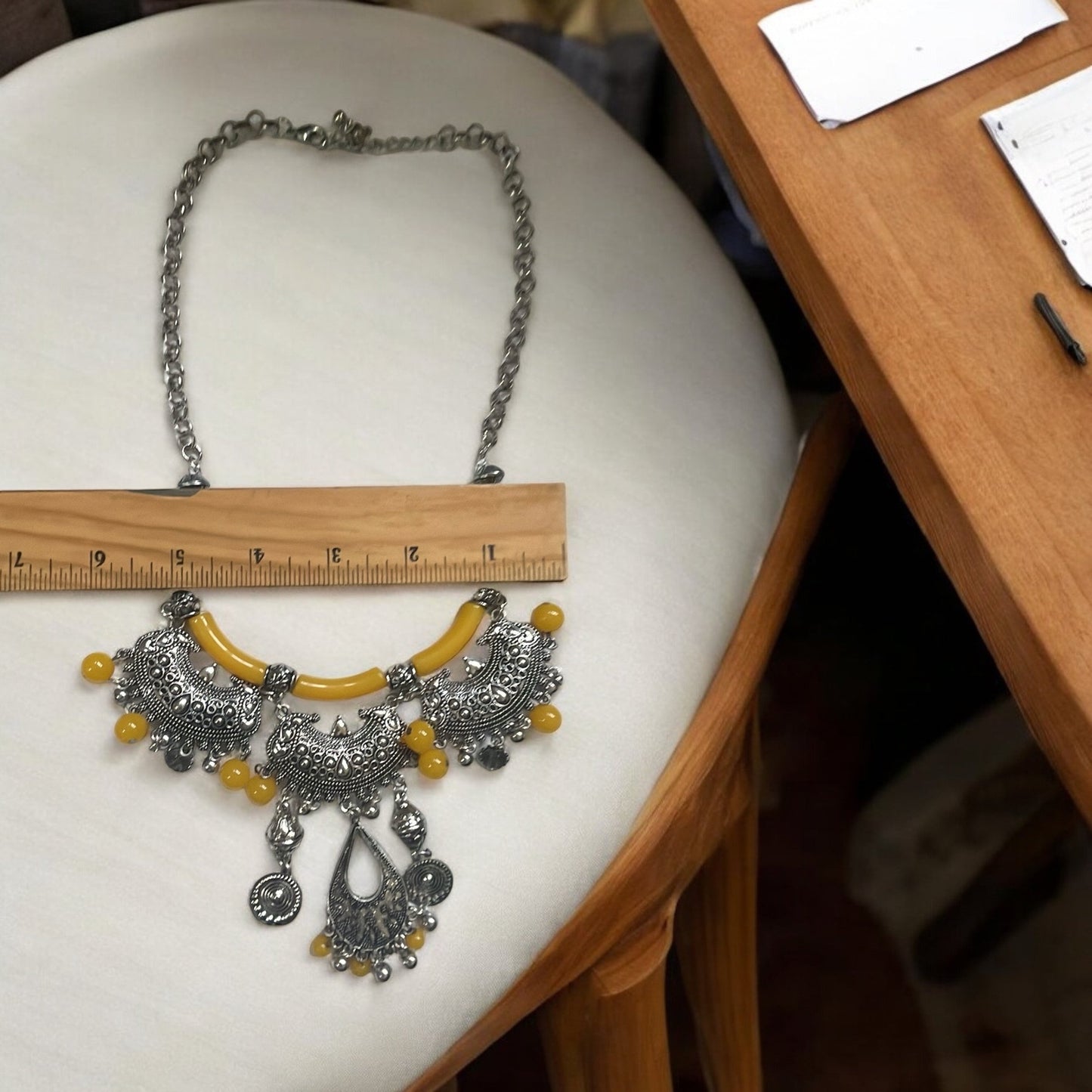 Exotic Indian style necklace with yellow beaded balls/tubes and ornate silver trim