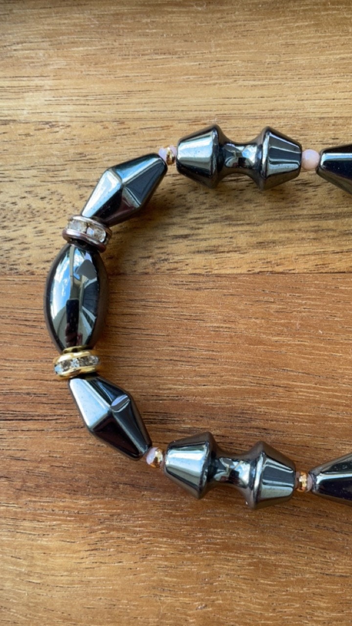 Vintage hematite necklace with uniquely shaped hematite beads and rhinestone spacers