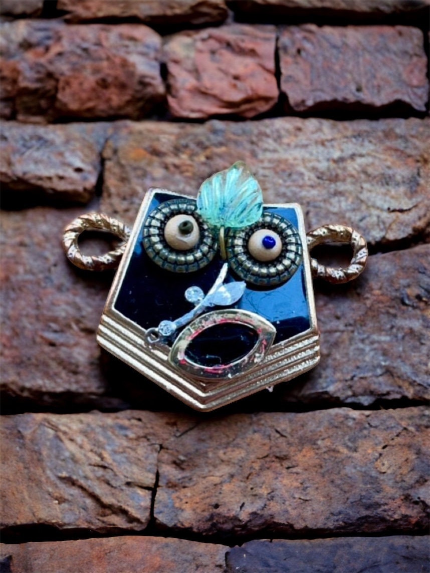This monkey is a really cool assemblage art piece - it can be transformed into a necklace pendant, pin, magnet, small ornament or ring