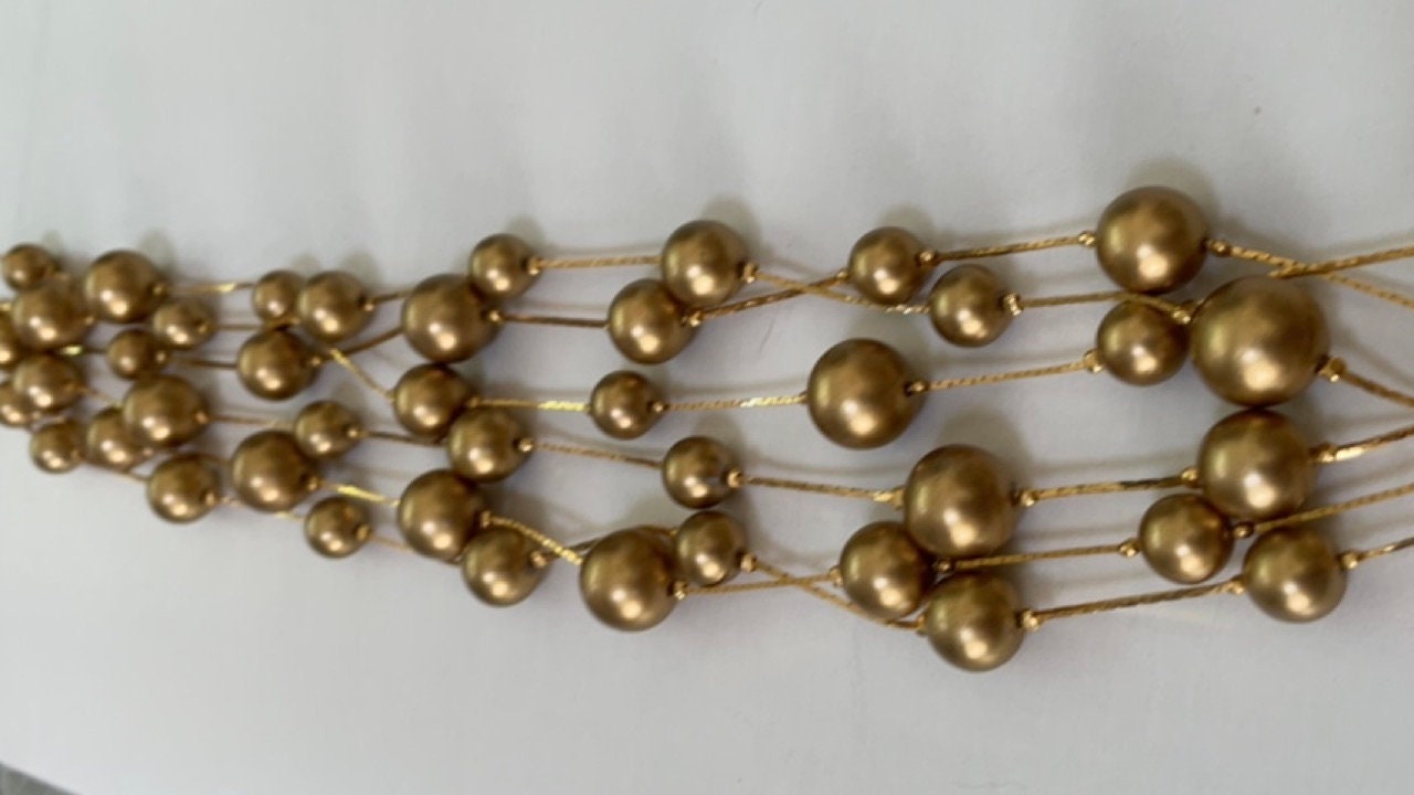 Stunning vintage multi strand goldtone faux pearl necklace