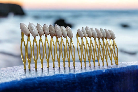 Stunning goldtone hair comb with white shells
