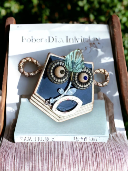 This monkey is a really cool assemblage art piece - it can be transformed into a necklace pendant, pin, magnet, small ornament or ring