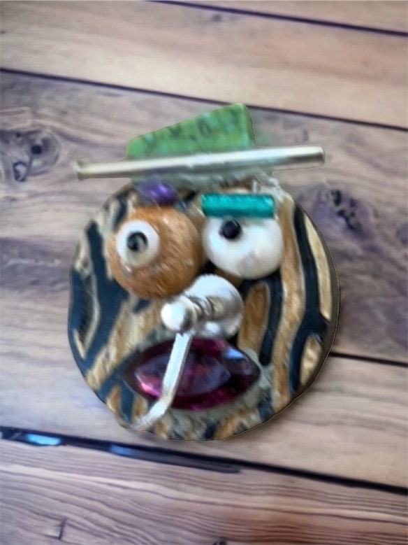 Handmade, one-of-a-kind assemblage art - can be ordered as a necklace, pin or magnet