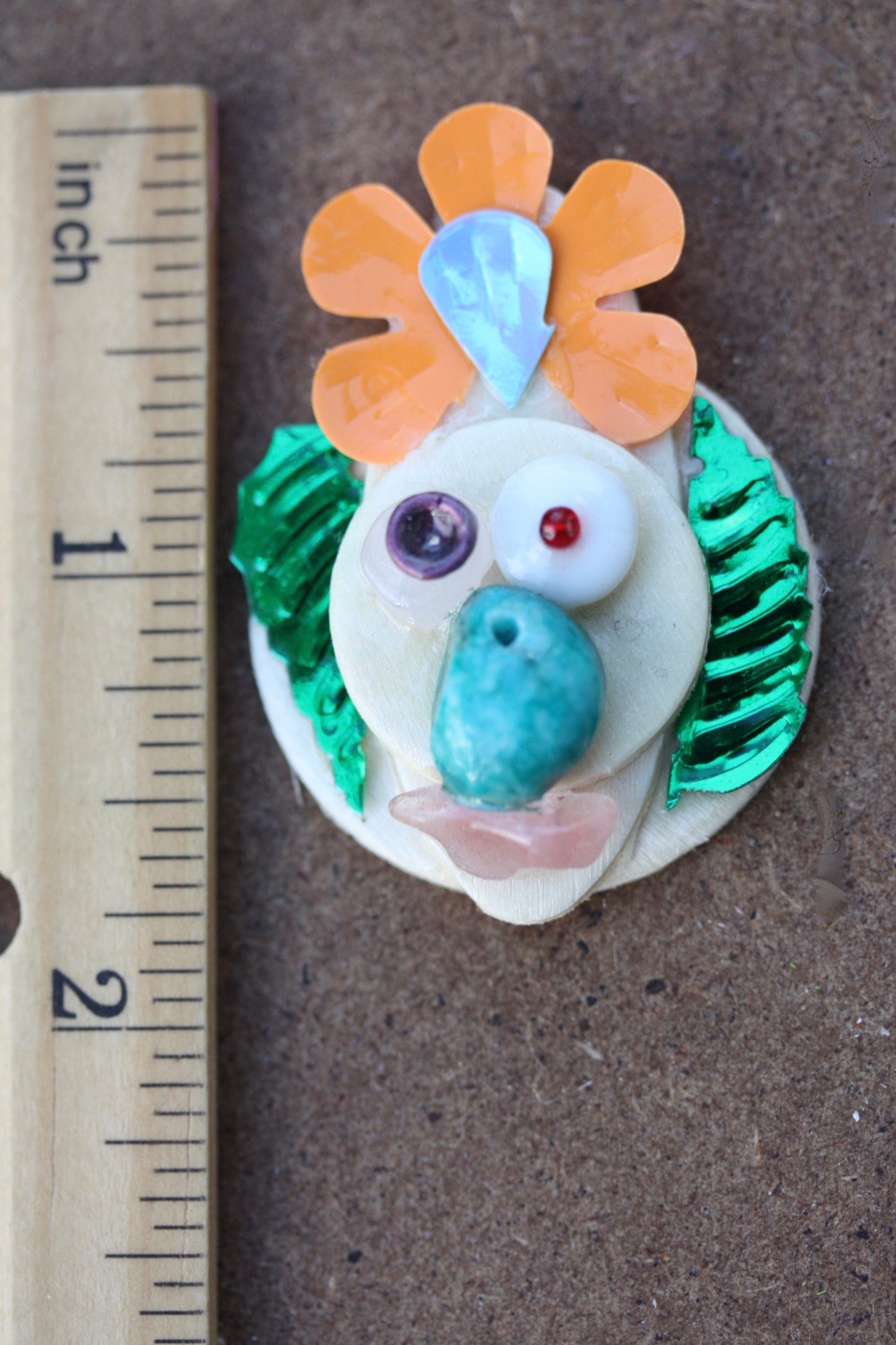 Meet "The Confused Bird" - Assemblage art / mixed media collage - magnet, lapel pin or necklace pendant