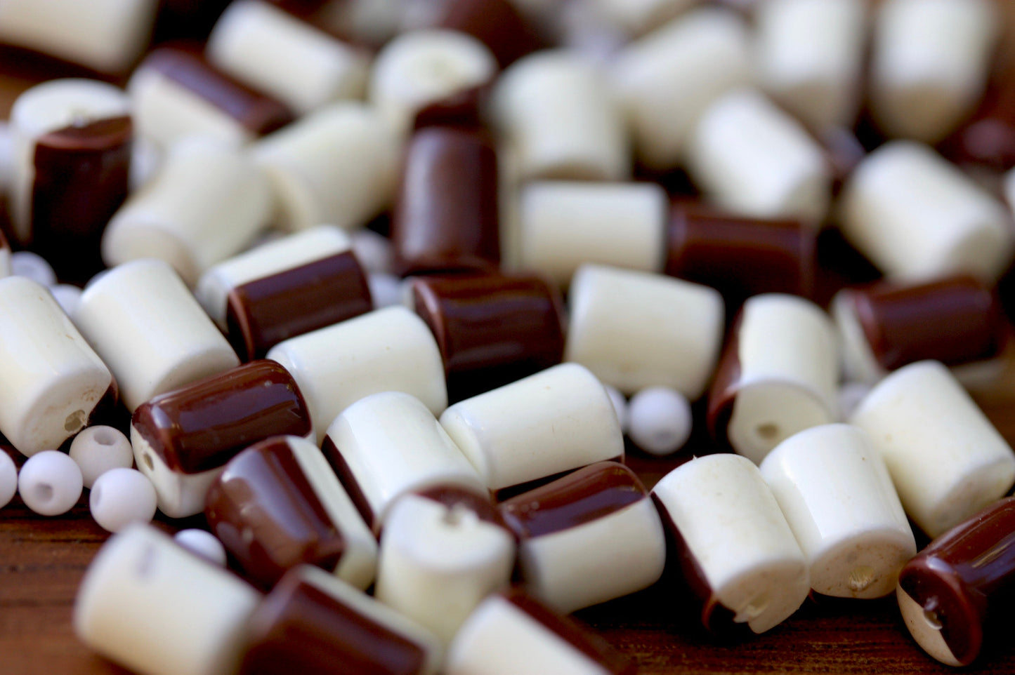 One dozen unique half brown, half creamy white vintage beads