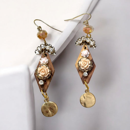 Dangle earrings with wood diamonds from a broken vintage rosary, etched roses, rhinestone, crystals and hammered discs. Sterling ear wires.