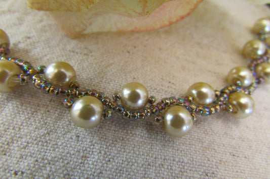 Light copper tone glass pearls with iridescent glass seed beads (in various hues) handmade beaded bracelet