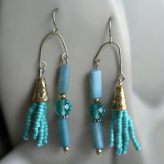 Asymmetrical mixed material turquoise crystal, stone and seed beads with goldtone trim - 2 and one-half" long earrings
