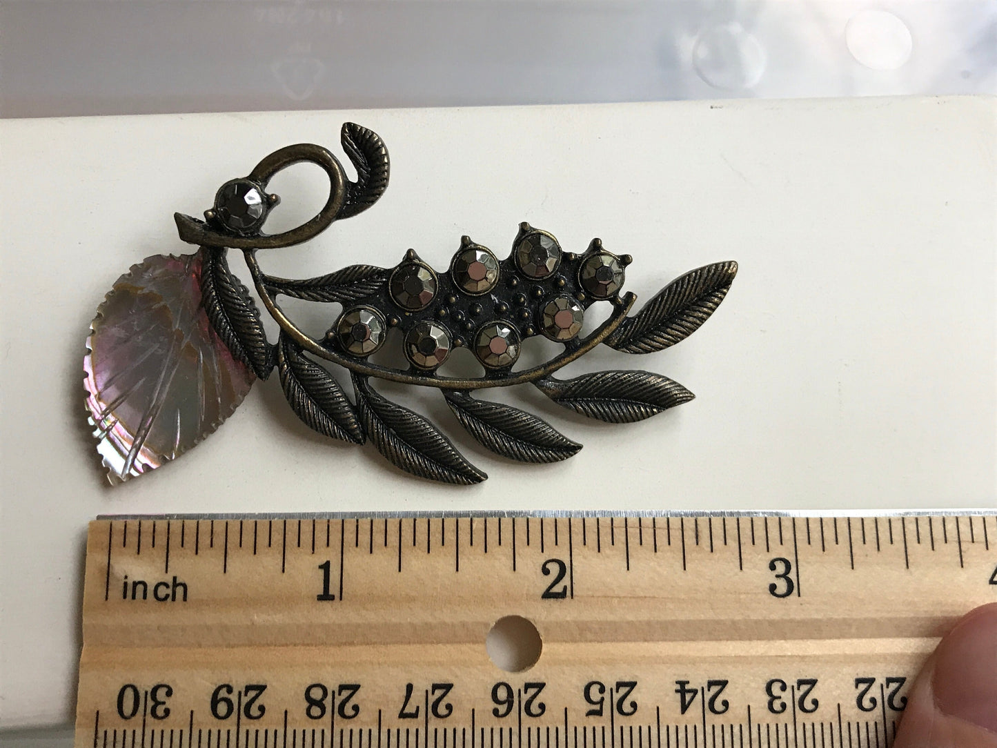 Stunning and unique vintage metal and rhinestone pin with abalone leaf