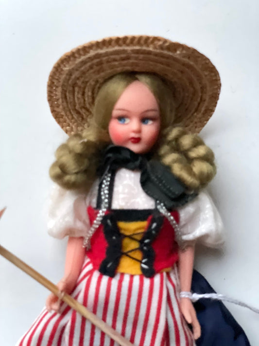 Vintage collectible handmade doll from Luganos Switzerland - with traditional handmade clothing and wooden rake