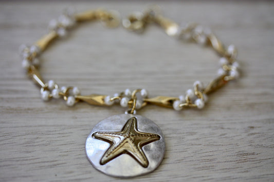 Handmade bracelet made with upcycled / repurposed vintage silver tone and gold tone starfish dangle, charm bracelet