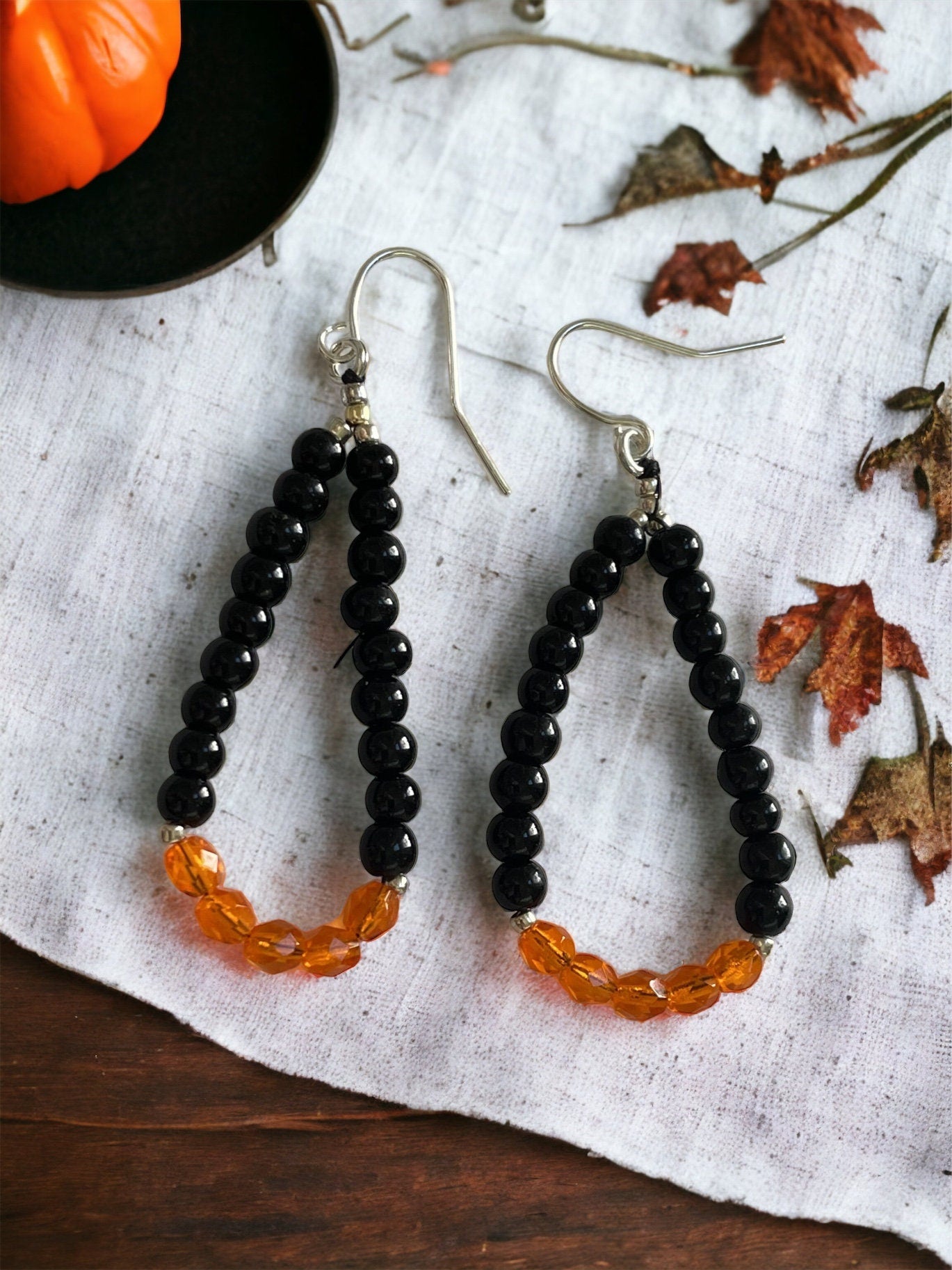 Hand beaded color block dangle hoop earrings - orange and black glass beads - perfect for the fall and Halloween