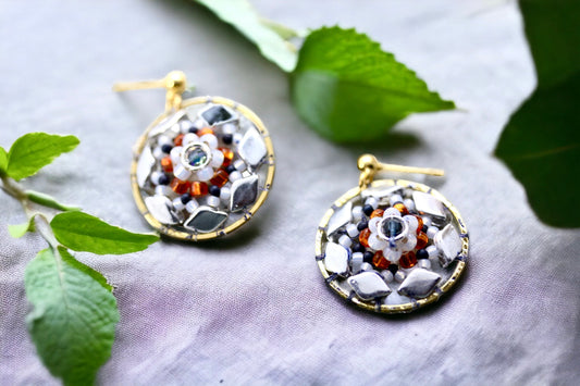 Orange and navy blue intricate beadwork small circular dangle earrings