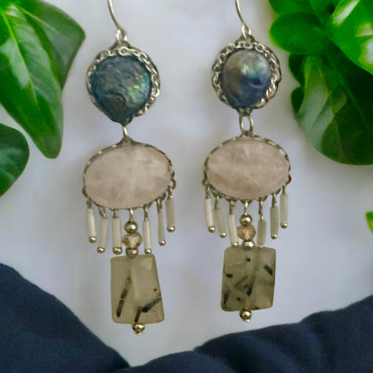 One-of-a-kind dangle earrings made with gray cultured pearls, rose quartz, Rutilated Quartz and white tube glass dangles. Sterling ear wires