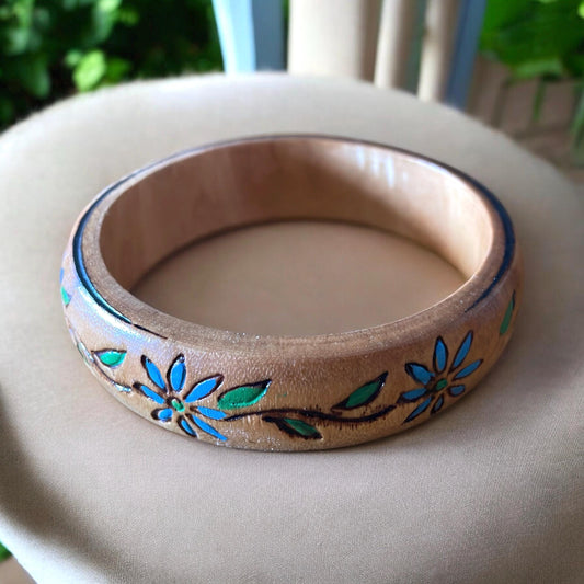 Carved wooden vintage bangle bracelet with blue flowers and green leaves