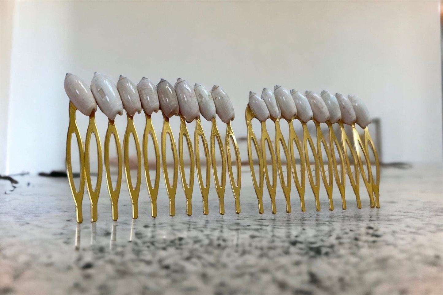 Stunning goldtone hair comb with white shells