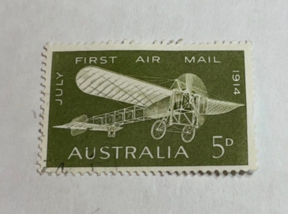 Necklace pendants made from genuine vintage and antique postage stamps from around the world - saints, Australian plane, Wicca sun and moon