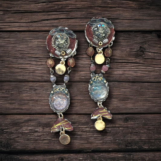 One-of-a-kind earrings made with, paper, fabric, velvet, rhinestones, chain, mixed metals and postage stamp remnants. Sterling ear wires.
