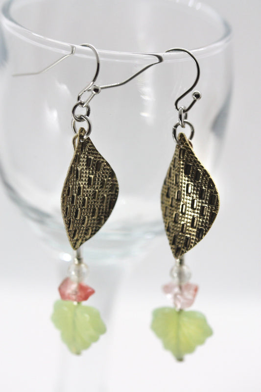 Handmade dangle earrings made of vintage textured metal leaves, pink gemstone chips and light green opaline glass ginko flower leaves