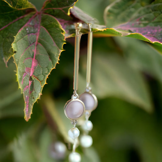 Handmade earrings - made of upcycled vintage components combined with new - light amethyst colored frosted glass with goldtone bugle beads