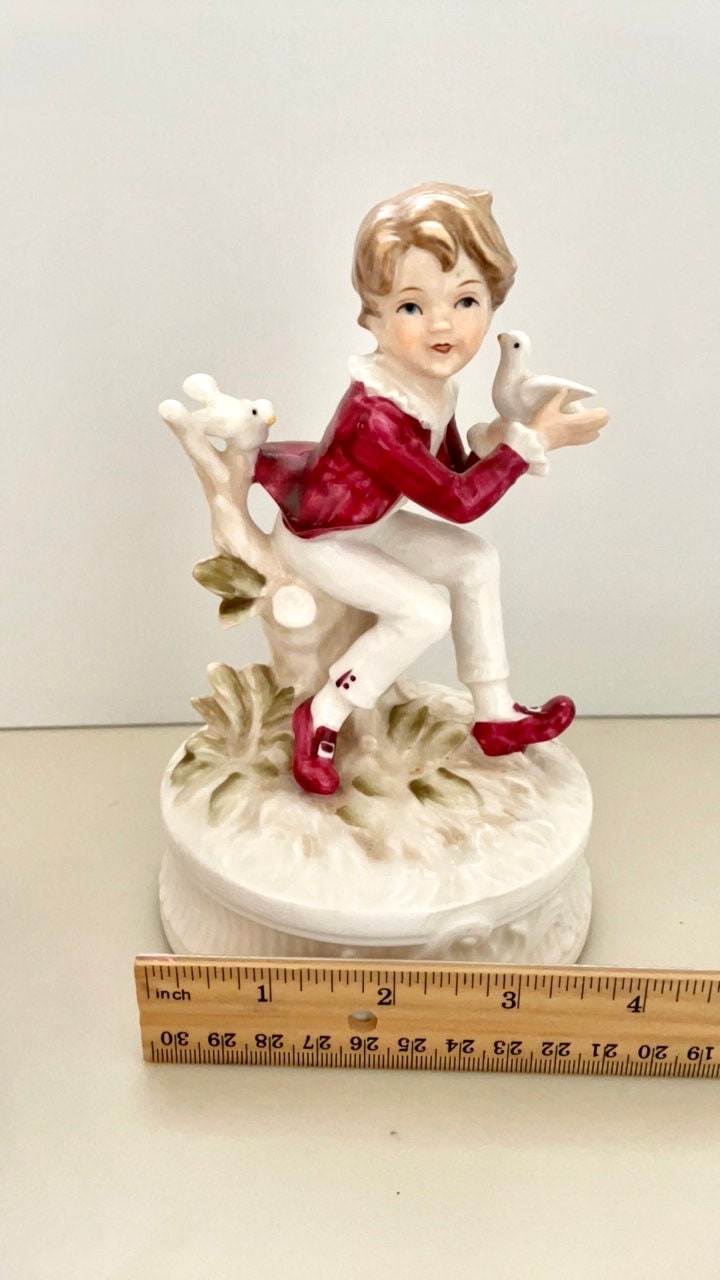 1977 Berman and Anderson stunning porcelain music box - boy dressed in red and white feeding birds