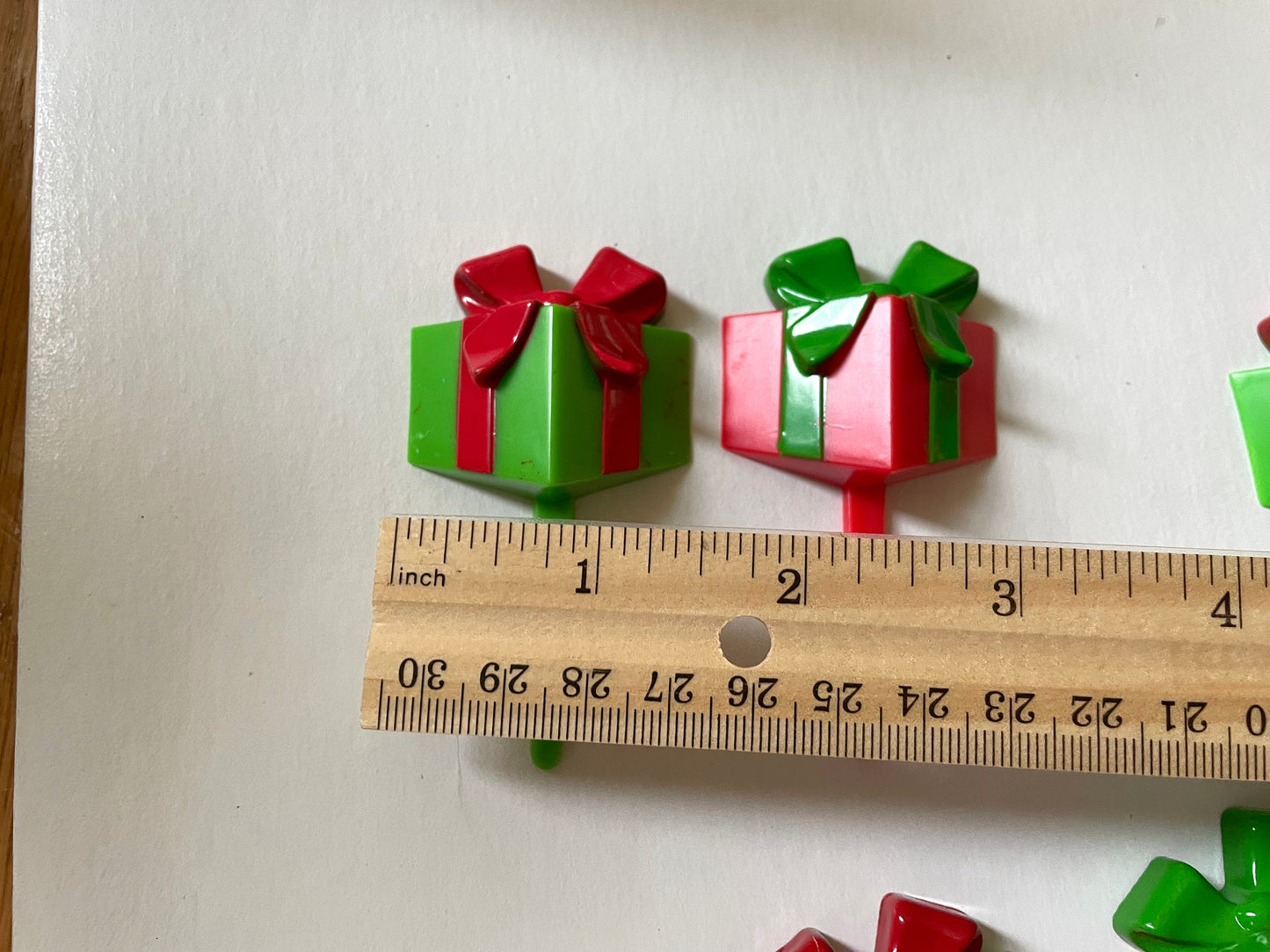 One dozen christmas cupcake toppers - Mix of red and green 3D plastic cake toppers - little wrapped packages with bows