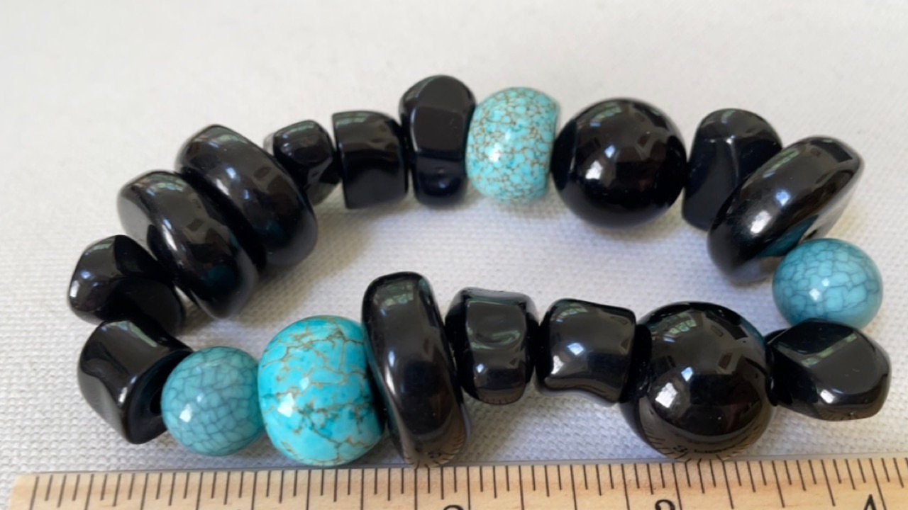 Stunning vintage mixed sizes and shapes of black and faux turquoise beaded bracelet