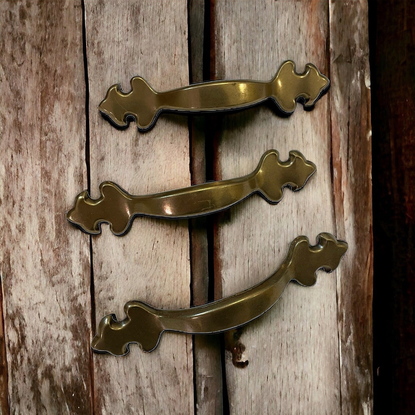 Set of three vintage brass? drawer pulls