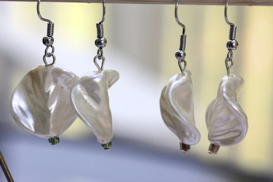 Pearlescent leaves dangle earrings trimmed with tiny sparkly seed beads