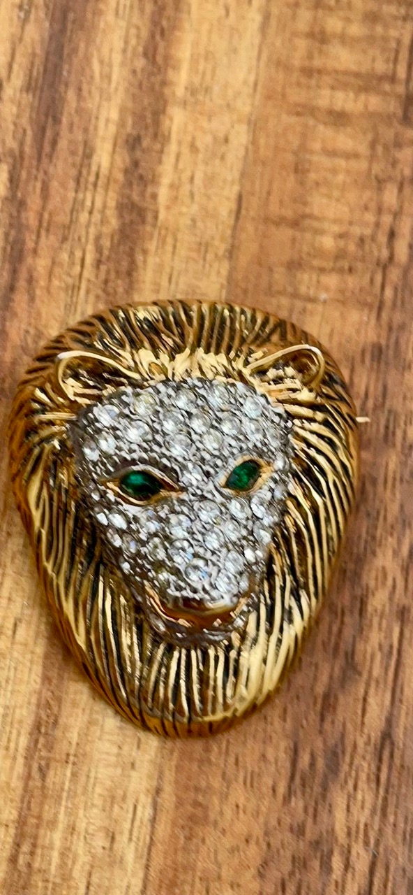 Stunning pave rhinestone lion's head vintage pin, green eyes - vintage brooch