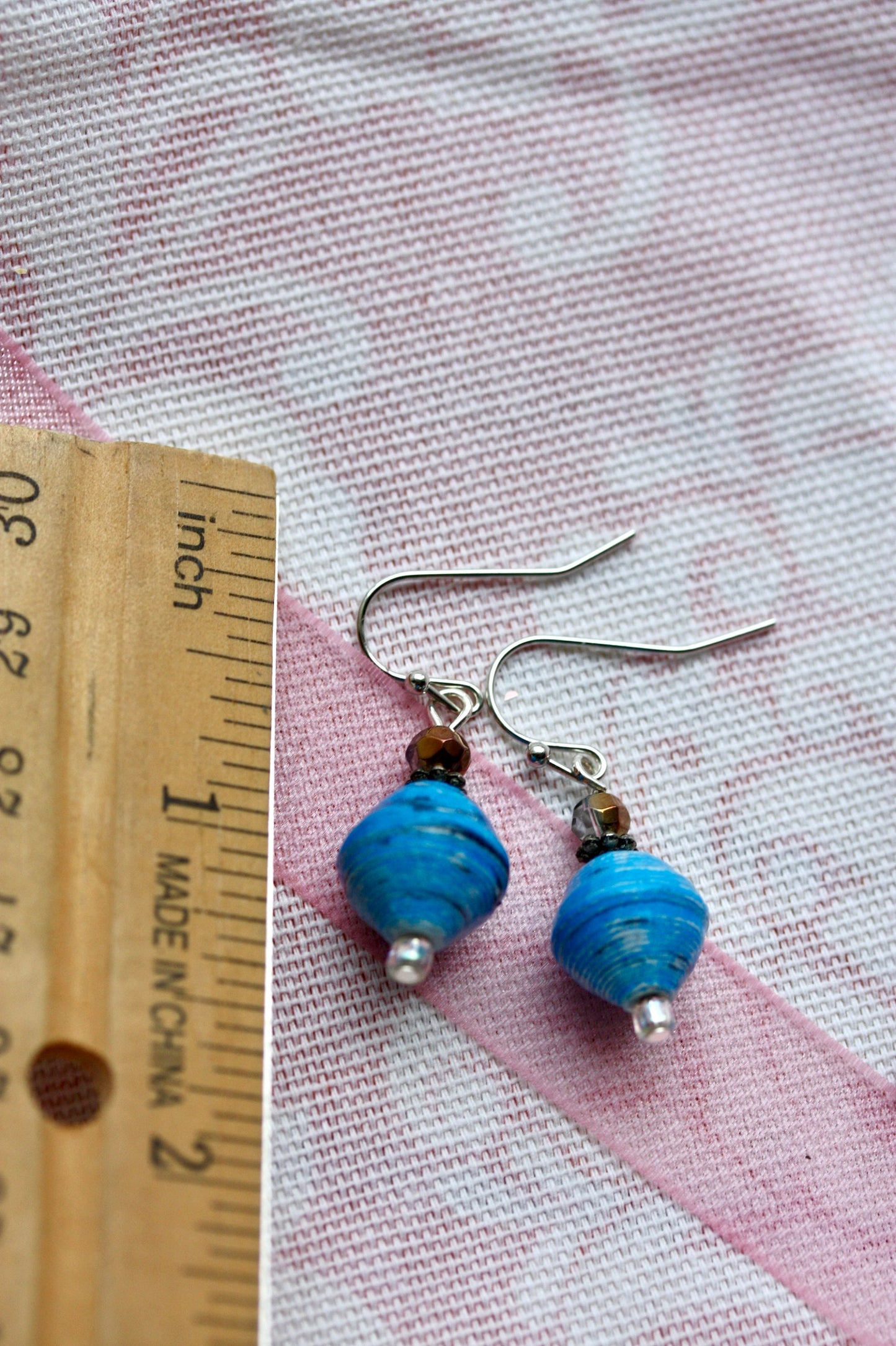 Little dangle earrings made with blue rolled paper, crystal and white sparkly glass beads