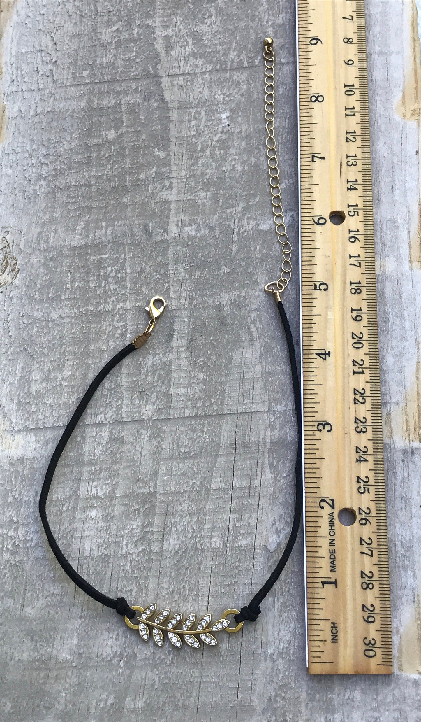 Vintage Rhinestone feather on black vintage necklace