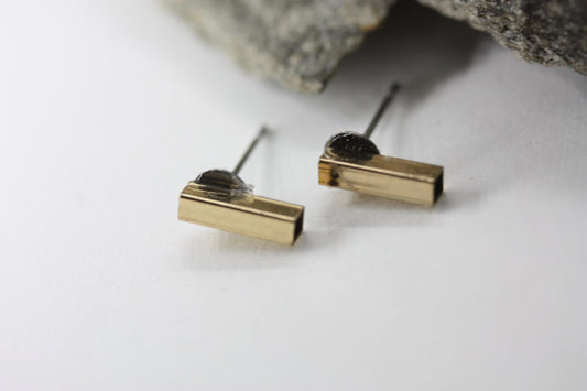 Tiny barely-there goldtone bar on silvertone circle minimalist stud earrings