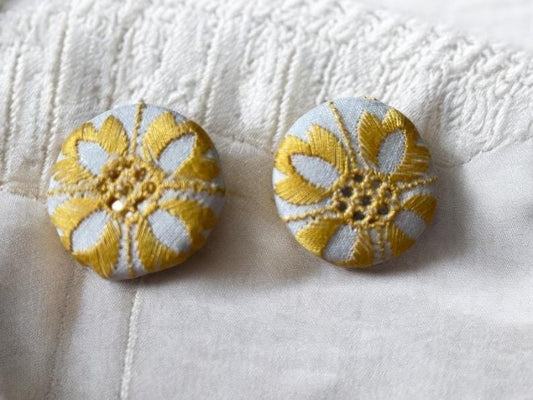 Choice of stud earrings, dangle earrings, hair combs, shanked buttons or pins all hand made from a vintage linen embroidered table runner