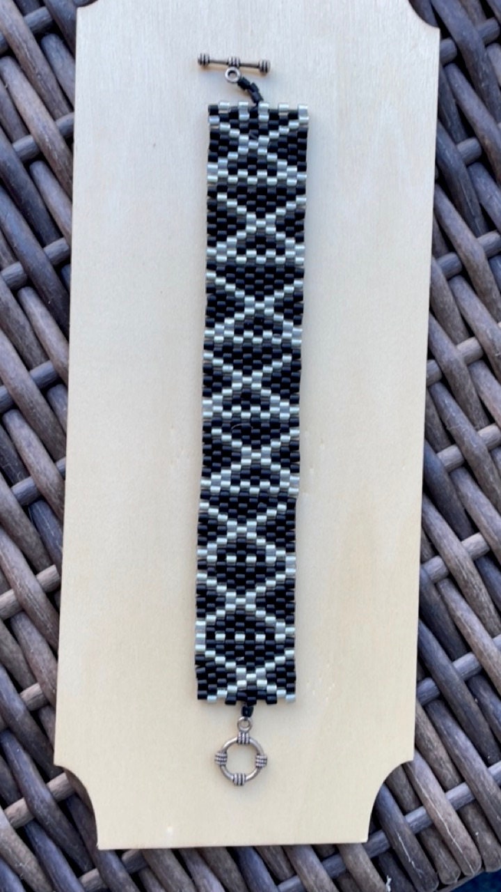 Stunning vintage silver and black hand woven vintage beadwork bracelet