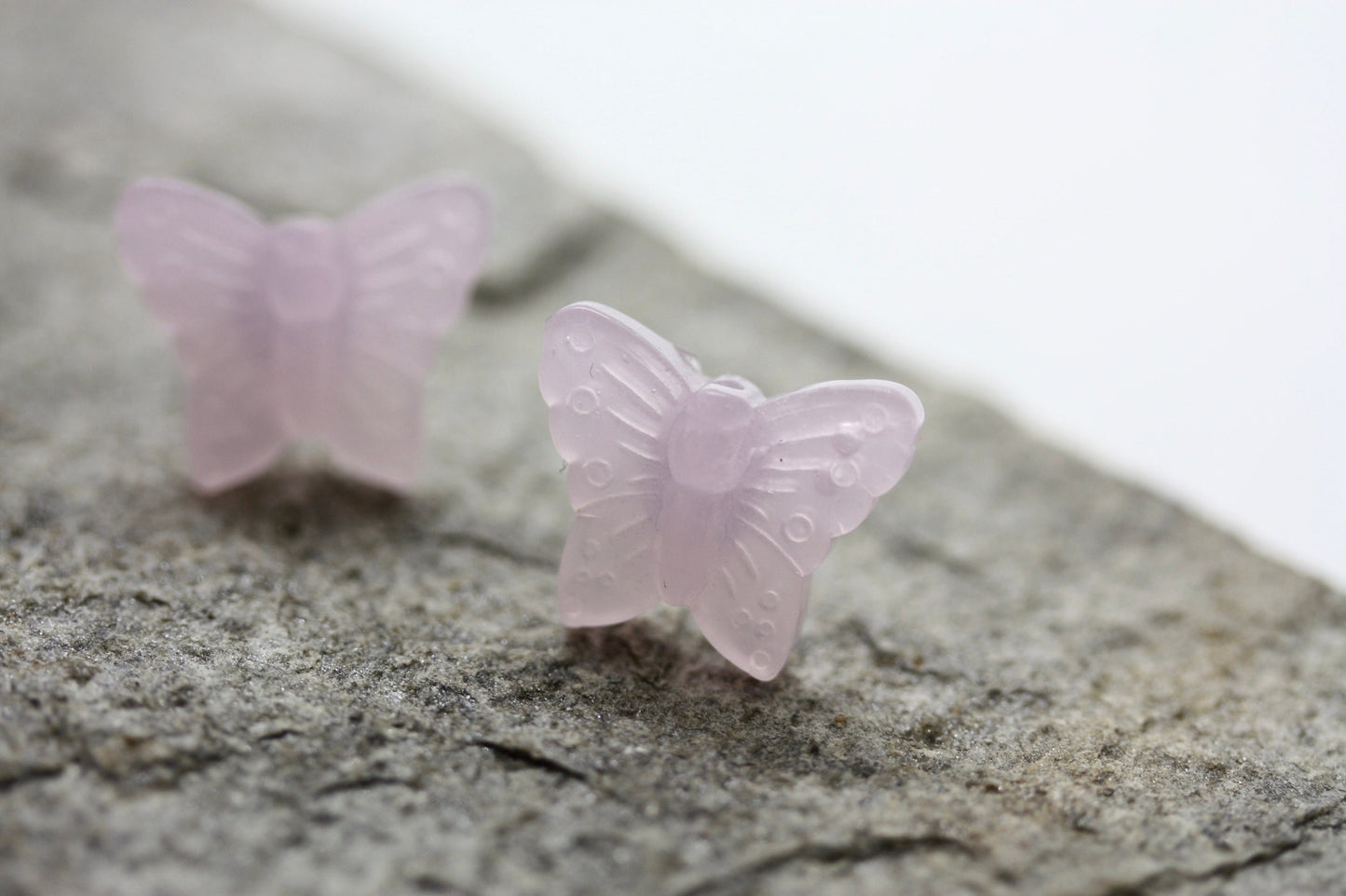 Small little light pink butterfly stud earrings