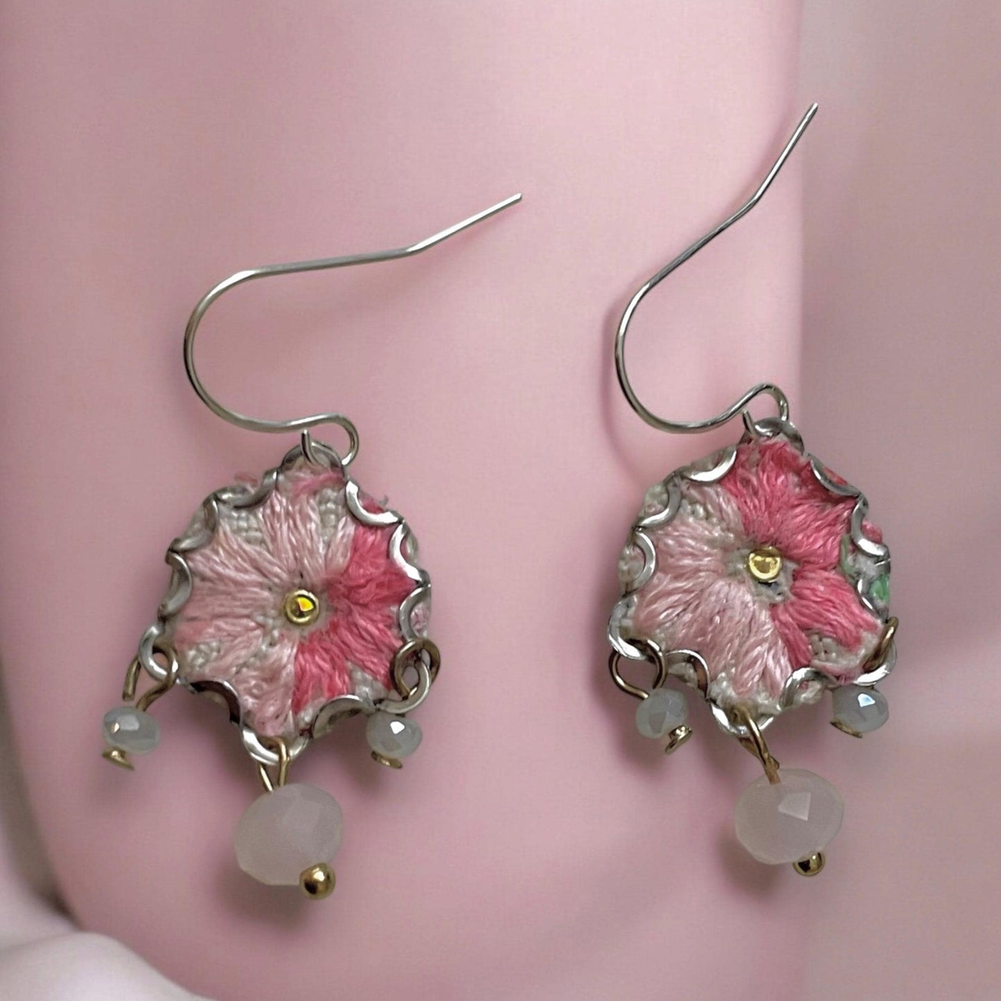 Handmade shades of pink mixed media earrings made with embroidery from a vintage linen table runner, combined with tiny dangles