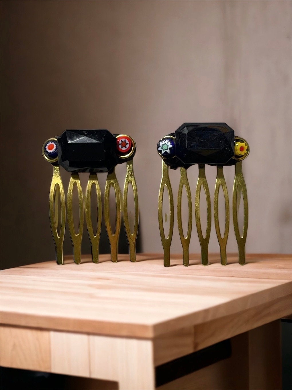 Pair of one-of-a-kind handmade Italian glass micro mosaic hair combs with millefiori around vintage black bezel