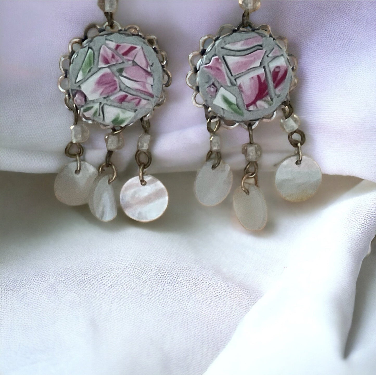 Unique earrings made of hand cut mosaic tile from vintage plates combined with mother of pearl dangles