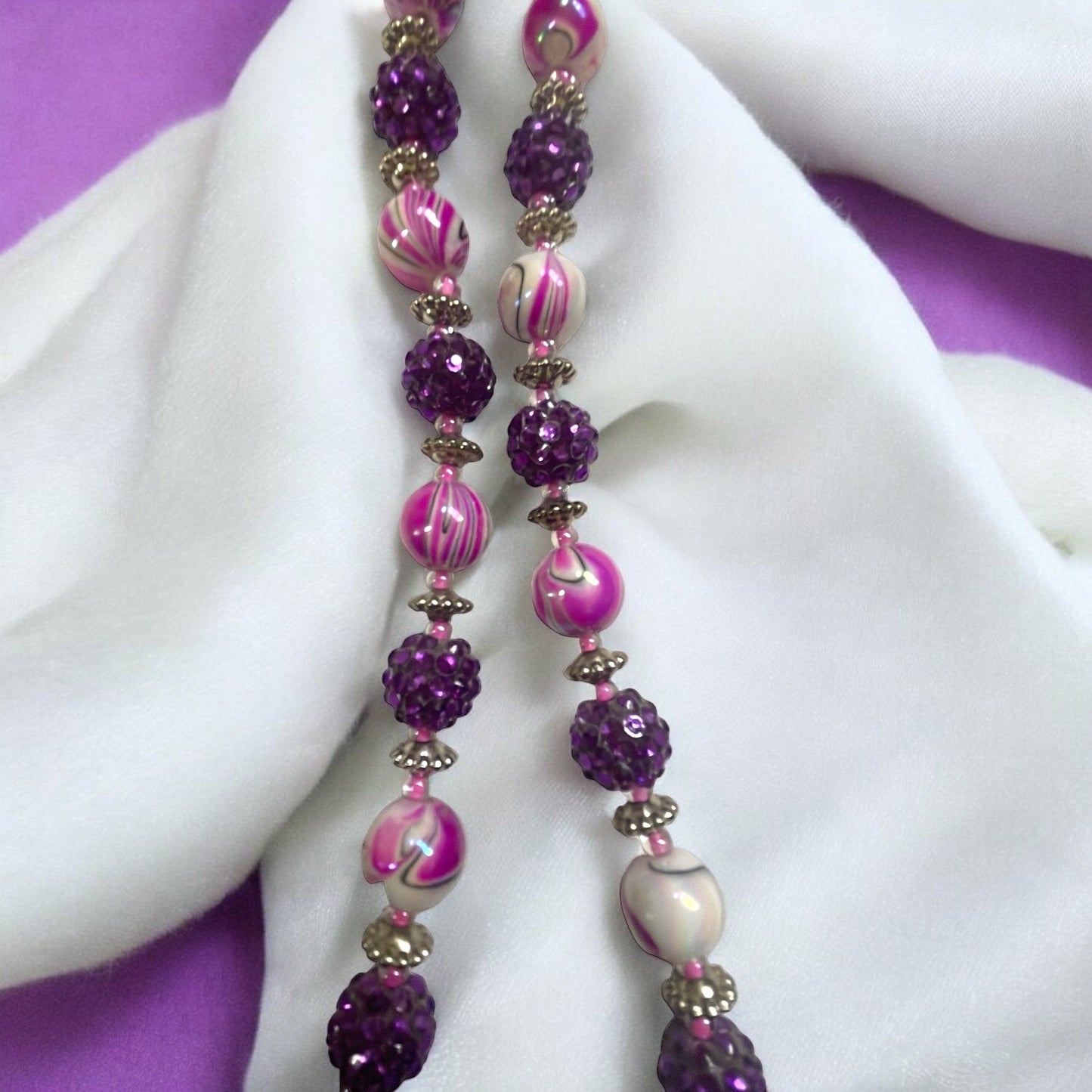 Shades of pinkish purple swirled vintage necklace with purple rhinestone beaded balls