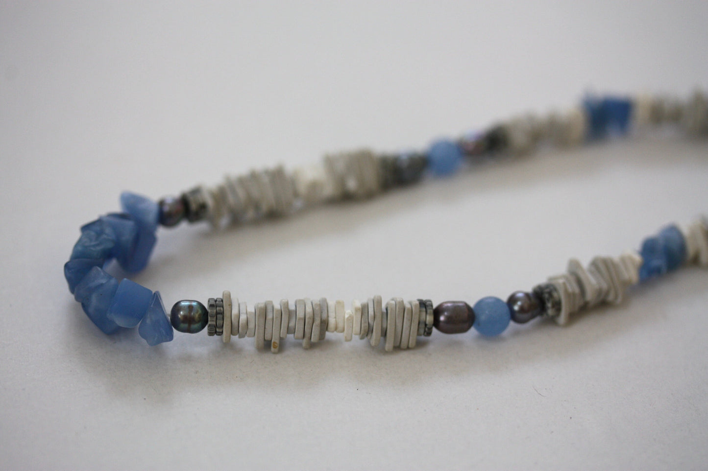 Unique vintage necklace with white shell heishi beads with blue semi precious stone chips