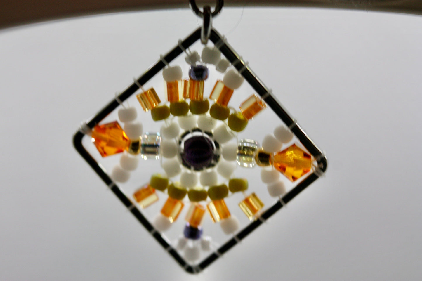 Orange, green, purple and white crystal and intricate beadwork small square dangle earrings