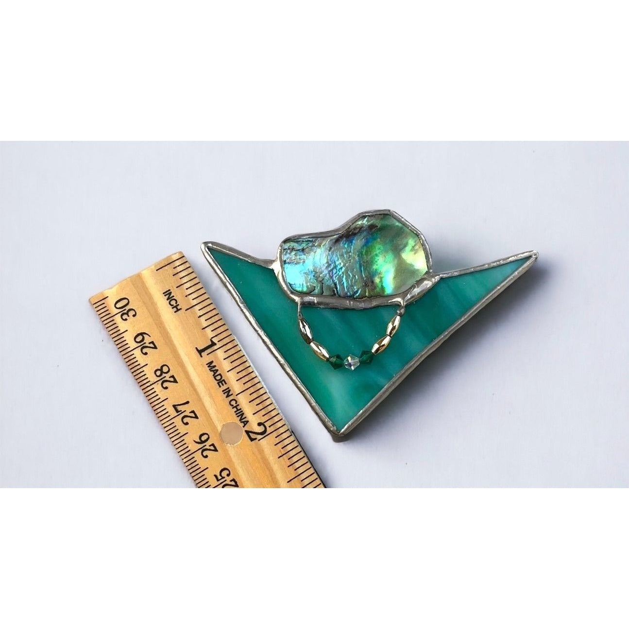 Stunning and unique 2 1/2" vintage triangular stained glass pin with abalone and beadwork