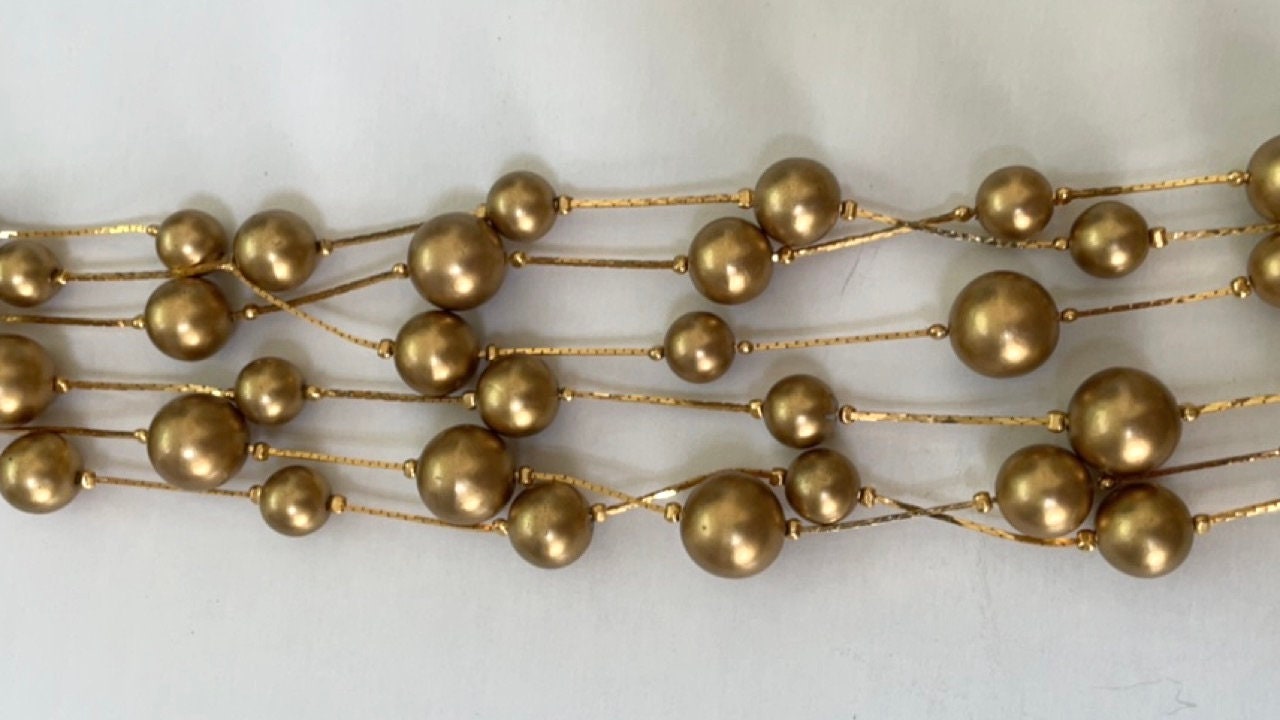 Stunning vintage multi strand goldtone faux pearl necklace